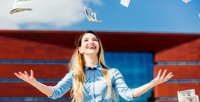 young businesswoman with cash money